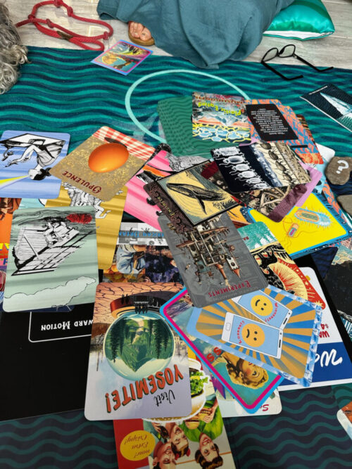 Game play on the floor of a gallery, several cards from The Iceberg are face up