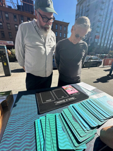 two men consider the game board